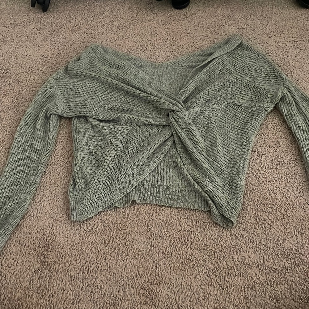 Green crosses back off the shoulder sweater